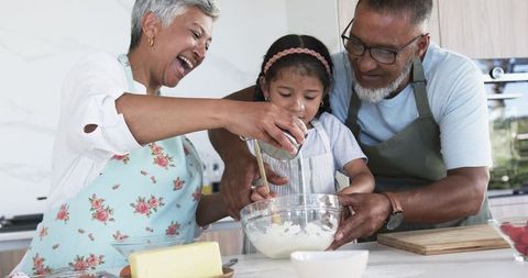 Happy Biracial Family Baking Together in Kitchen