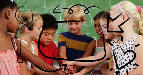 Diverse children teamwork in classroom with creative doodles