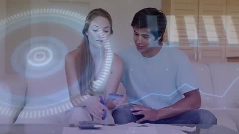 Couple Collaborating on Financial Planning with Futuristic Overlay