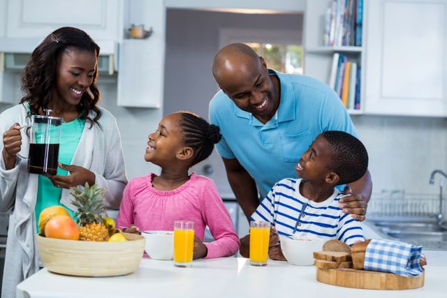 Happy African American Family Enjoying Breakfast in Kitchen - Download Free Stock Photos Pikwizard.com