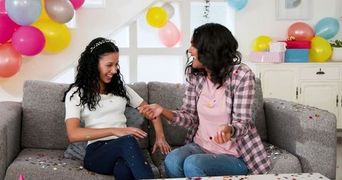 Joyful Celebration with Colorful Balloons and Confetti Indoors