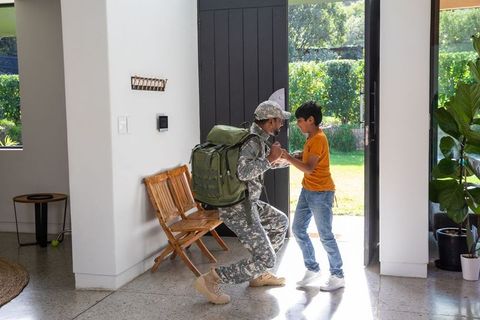 Military Father Reunites with Son at Home Doorway