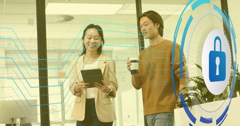 Modern office professionals engaging in cybersecurity discussion