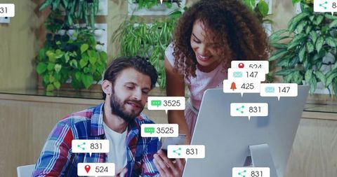 Tech-Savvy Team Collaborating in Startup Office with Digital Interfaces