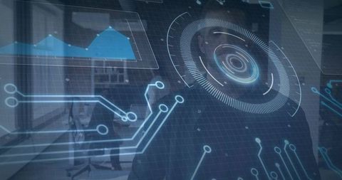 Standing male-presenting executive facing camera in office with holographic hud analytics