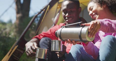 Diverse Couple Enjoying Tea During Camping Trip