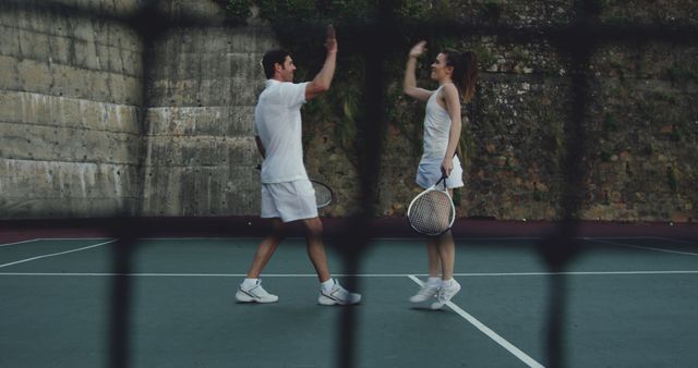 Mixed Doubles Tennis Players Celebrating on Court - Download Free Stock Images Pikwizard.com