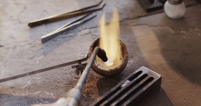 Craftsperson Melting Metal in Crucible in Workshop - Download Free Stock Images Pikwizard.com