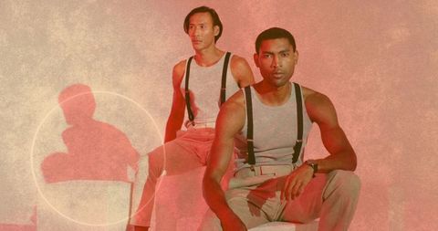 Two Stylish Men Sitting on Stools in Minimalist Fashion