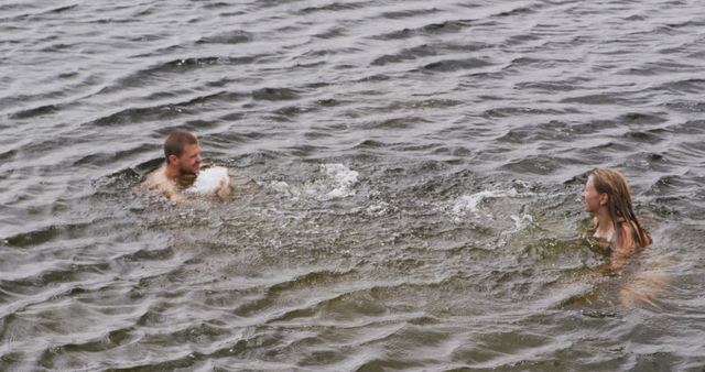 Two Friends Playing in Lake Water on Summer Day - Download Free Stock Images Pikwizard.com