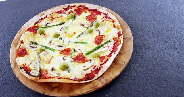 Gourmet Veggie Thin-Crust Pizza with Cheese and Olives - Download Free Stock Images Pikwizard.com