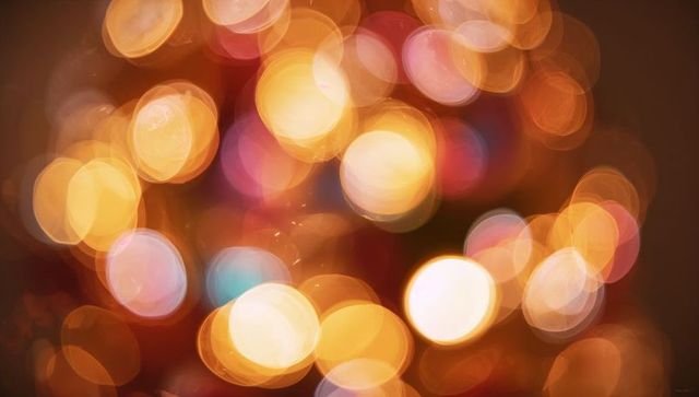 Warm Golden Bokeh Lights Abstract Background for Festive Decorations and Holiday Designs