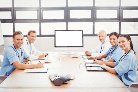 Transparent Doctors Smiling at Conference Table in Well-Lit Room - Download Free Stock Videos Pikwizard.com