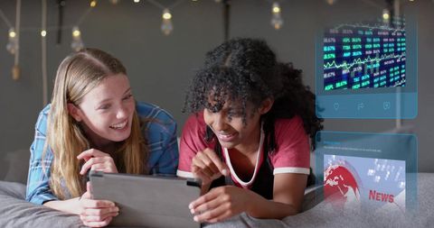 Diverse Women Using Tablet with Data Processing Remotely