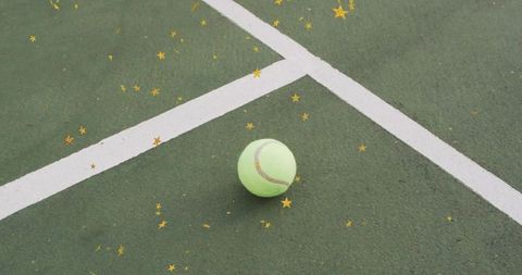 Tennis Ball on Court with Sparkling Gold Stars
