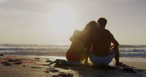 Romantic Couple Relaxing on Beach with Surfboard at Sunset - Download Free Stock Images Pikwizard.com