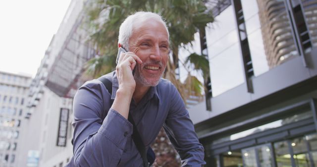 Senior Businessman on Phone Call Outdoors in Urban Area - Download Free Stock Images Pikwizard.com