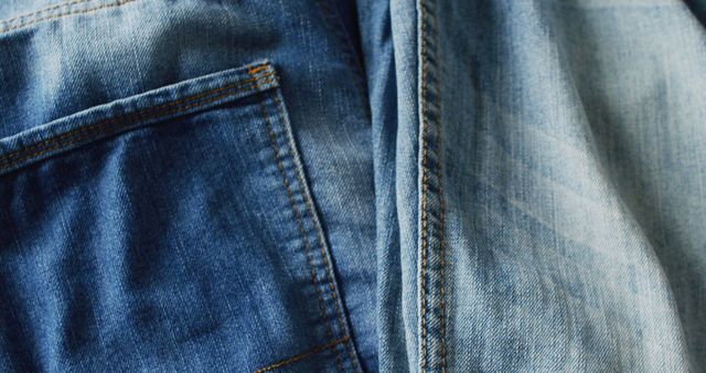 Close up of jeans with different shades with copy space. Denim day, material, style and design concept.