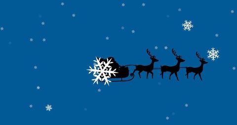 Silhouette of Santa's Sleigh with Reindeer in Snowy Night Sky
