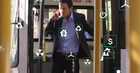 Business commuter handling ringing phone on bus with floating sustainable energy icons