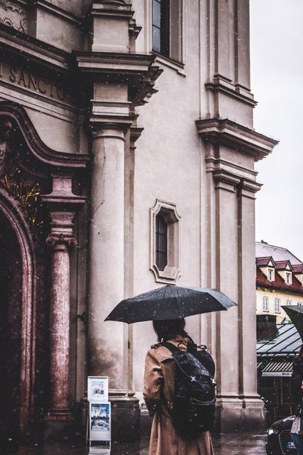 Person with Umbrella by Historical Building on Rainy Day - Download Free Stock Images Pikwizard.com