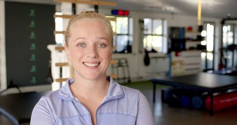Smiling Woman in Rehabilitation Center Promoting Wellness