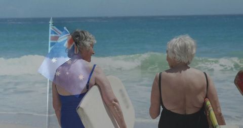 Senior Women Enjoying Seaside Adventure with Bodyboards