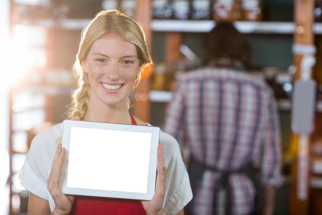 Smiling Supermarket Staff Presenting Transparent Digital Tablet Display - Download Free Stock Videos Pikwizard.com