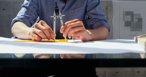 Architect Planning Blueprint with Compass in Modern Office - Download Free Stock Images Pikwizard.com