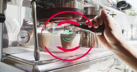 Barista pouring espresso from portafilter into cup with stainless espresso machine closeup