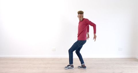 Dance Enthusiast Moving Joyfully on Elegant Wooden Floor - Download Free Stock Images Pikwizard.com