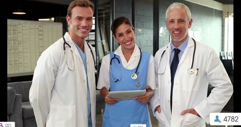 Healthcare Team Smiling and Collaborating with Digital Tablet