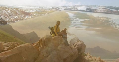 Adventurous Hiker Exploring Scenic Cliffside