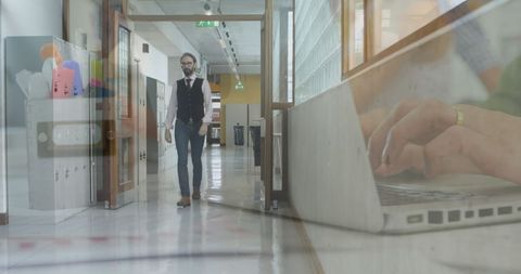 Businessman Walking in Office Corridor with Technology Overlay - Download Free Stock Images Pikwizard.com