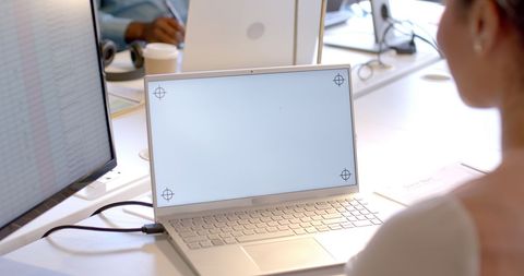 Business Professional Using Laptop with Blank Screen for Copy Space