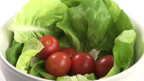 Fresh Salad Bowl with Green Lettuce and Red Cherry Tomatoes