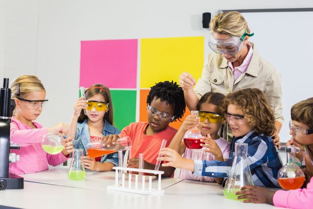 Teacher Guiding Kids in School Laboratory Experiment - Download Free Stock Photos Pikwizard.com