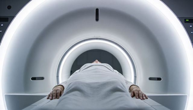 Patient entering mri scanner bore with ring lighting for diagnostic radiology examination