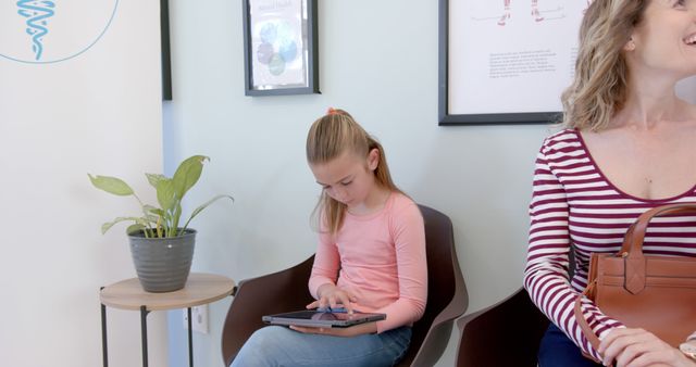 Young Girl Using Tablet in Doctor's Waiting Room - Download Free Stock Images Pikwizard.com