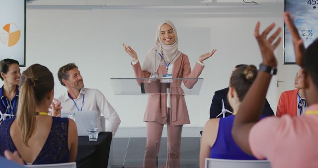 Young Female Motivational Speaker Engaging Audience at Conference - Download Free Stock Images Pikwizard.com