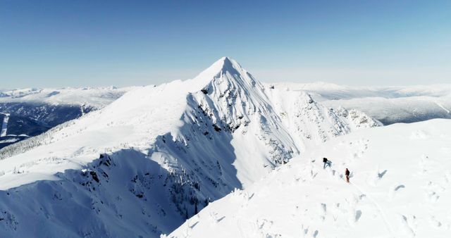 Hikers Trekking Through Pristine Snow-Covered Mountain Range - Download Free Stock Images Pikwizard.com