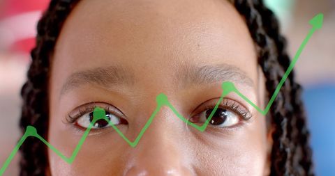 Visionary businesswoman with growth chart overlay