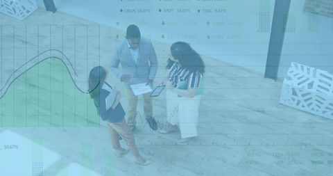 Team Collaborating on Business Data in Modern Office Environment