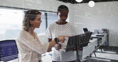 Diverse business team analyzing data on laptop technology concept