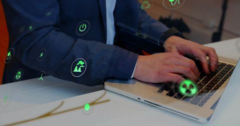 Corporate professional typing on laptop with green sustainability and energy holograms