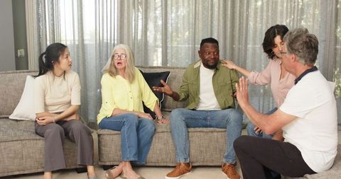 Group therapy session fostering diverse conversation and healing