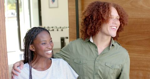 Happy Diverse Couple Enjoying Time in New Home