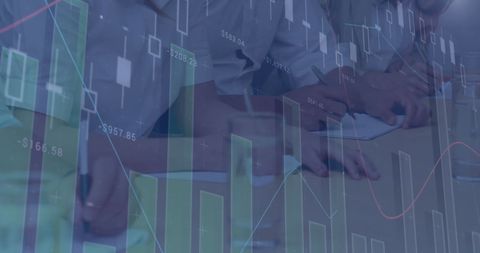 Business Colleagues Analyzing Financial Graphs in Office Meeting