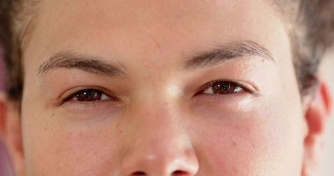 Close-up portrait showcasing natural freckled skin texture