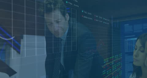 Business Team Analyzing Financial Data in Dynamic Office Environment